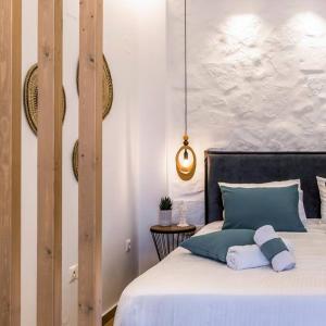A bed or beds in a room at Sofilins Luxury Suite
