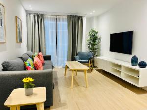 TV a/nebo společenská místnost v ubytování Sun & Beach La Strada