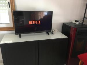 TV a/nebo společenská místnost v ubytování Apartamentos Gamela en Playa Canido - Vigo + 5 fotografií