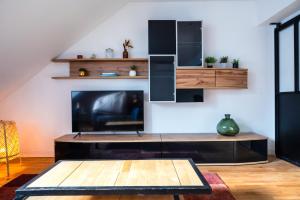 Televízia a/alebo spoločenská miestnosť v ubytovaní Appartement Confort, Hyper Centre à Tours, Climatisation