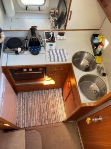 an overhead view of a kitchen with a sink at Barco Princess Cachucho Fly in Puerto Calero