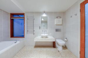 a bathroom with a tub sink and a toilet at Taman Sari Luxury Private Pavilions - Pet Friendly Accomodation in Mapleton