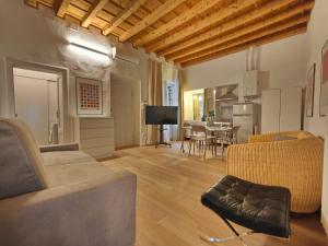 a living room with a couch and a table at Crocetta Charme Apartment in Milan