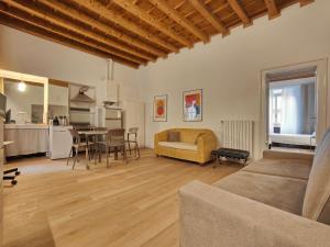 a living room with a couch and a table at Crocetta Charme Apartment in Milan