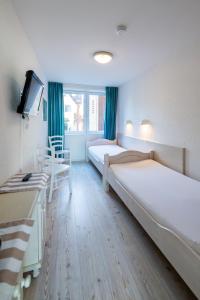 Ένα ή περισσότερα κρεβάτια σε δωμάτιο στο Nordland Appartements - Wohnung Seeland +45 φωτογραφίες