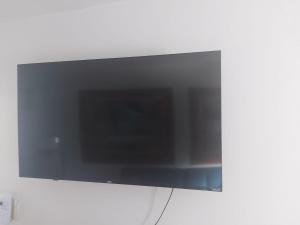a flat screen tv hanging on a wall at Casa Doña Guilla 2 