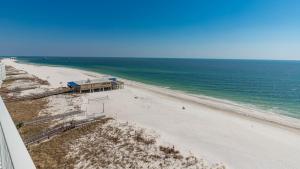 a view of a beach with a pier and the ocean at Seawind 809 condo in Gulf Shores