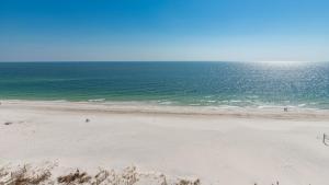 an empty beach with the ocean in the background at Seawind 809 condo in Gulf Shores