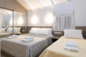 Posteľ alebo postele v izbe v ubytovaní Villa Pearl