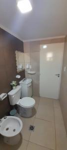 a bathroom with a toilet and a bidet at Amplio departamento a estrenar ! in Godoy Cruz