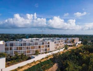 an aerial view of a large white building at The Waves Tulum in Tulum