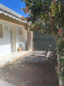 a patio of a house with a fence at ALIZÉ CAP in Sainte-Anne