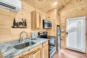 a kitchen with a sink and a stove at Greenbriar Place, Pickleball Court, Creek, WIFI, Mountain Views, Starting at 79" in Cosby