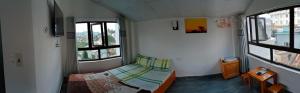 Postel nebo postele na pokoji v ubytování Nhà nghỉ Gia Tiến + 3 fotografie