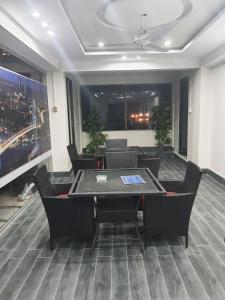 a meeting room with a table and chairs in a building at Hotel H6 in Rawalpindi