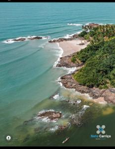 an aerial view of a beach and the ocean at Mini casa pé na areia in Ilhéus +12 photos