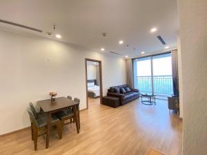 a living room with a table and a couch at Vinhomes Gardenia 16 Hàm Nghi,Mỹ Đình,Nam Từ Liêm in Hanoi