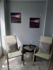 A seating area at "By The Sea" Family apartments