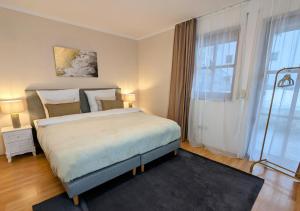 Postel nebo postele na pokoji v ubytování FeWo Goldstück mit privatem SPA und Whirlpool