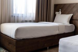 Postel nebo postele na pokoji v ubytování Hotel Resident Bishkek