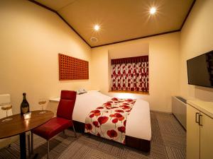 Postel nebo postele na pokoji v ubytování Hotel Rakuseki Honkan