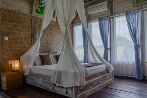 Postel nebo postele na pokoji v ubytování Ananda JJ Ubud Resort & Spa