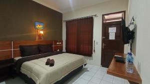 Yokima Beach Hotel 객실 침대