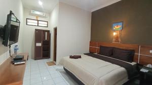 Yokima Beach Hotel TV 또는 엔터테인먼트 센터
