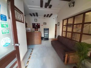 a living room with a couch in a room at Hotel The Holiday Home in Rishīkesh