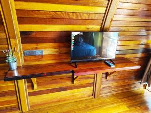 a television sitting on a table in a room at Mumsa Beach Resort & Restaurant in Ban Huai Yang