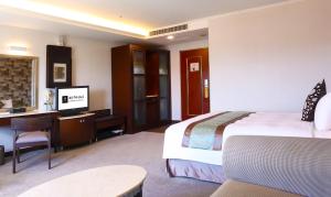 Postel nebo postele na pokoji v ubytování Zhong Ke Hotel