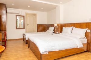 Letto o letti in una camera di YULOKO GUEST HOUSE