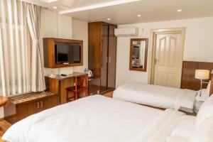 Letto o letti in una camera di YULOKO GUEST HOUSE