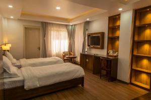 Letto o letti in una camera di YULOKO GUEST HOUSE