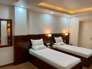 Letto o letti in una camera di YULOKO GUEST HOUSE