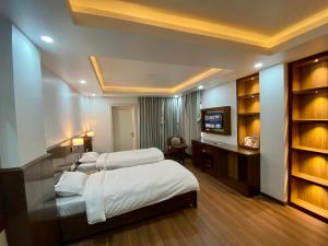Letto o letti in una camera di YULOKO GUEST HOUSE