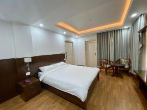 Letto o letti in una camera di YULOKO GUEST HOUSE
