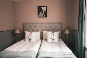 Voodi või voodid majutusasutuse Mojo Hotell toas