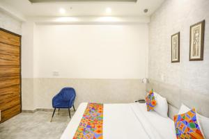 Ένα ή περισσότερα κρεβάτια σε δωμάτιο στο FabHotel F9 Sector 19