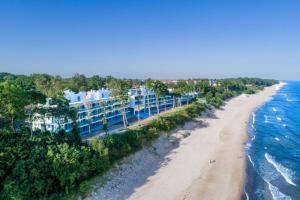 an aerial view of a beach with blue and white buildings at Rewal Hevenia The Best View ever in Rewal