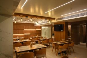 A restaurant or other place to eat at RATHNA RESIDENCY - Near US CONSULATE