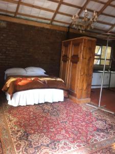a bedroom with a bed and a large rug at African feel studio with kitchenette - 2045 in Harare