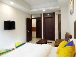 Hotel Soneva Inn客房内的一张或多张床位