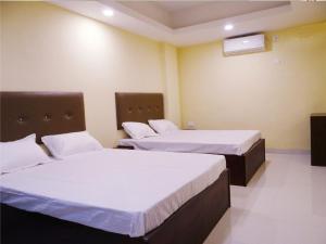 Hotel Soneva Inn客房内的一张或多张床位