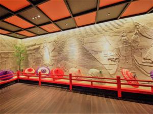 a bowling alley with a large mural on the wall at リブマックスリゾート安芸宮島 in Miyajima