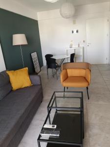 a living room with a couch and a table at Lykavitos Apartments in Nicosia