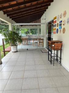 a living room with a table and a dining room at POUSADA ACONCHEGO MT in Chapada dos Guimarães