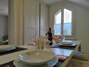 a person taking a picture of a table in a dining room at Uptown Apartments Interlaken free Parking in Interlaken