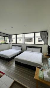 En eller flere senge i et værelse på 念念Nian Nian Taomi Inn