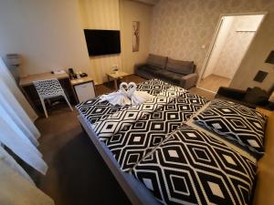 Postel nebo postele na pokoji v ubytování Hotel Boršičanka
